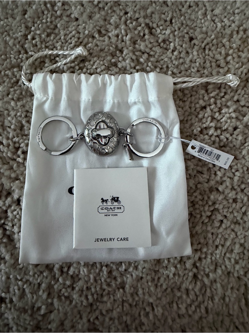 Coach NWT Silver Logo Turnlock Keyring Charm
